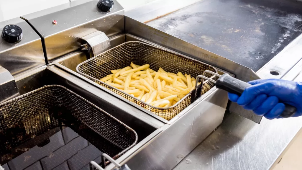 The chef cooking french fries